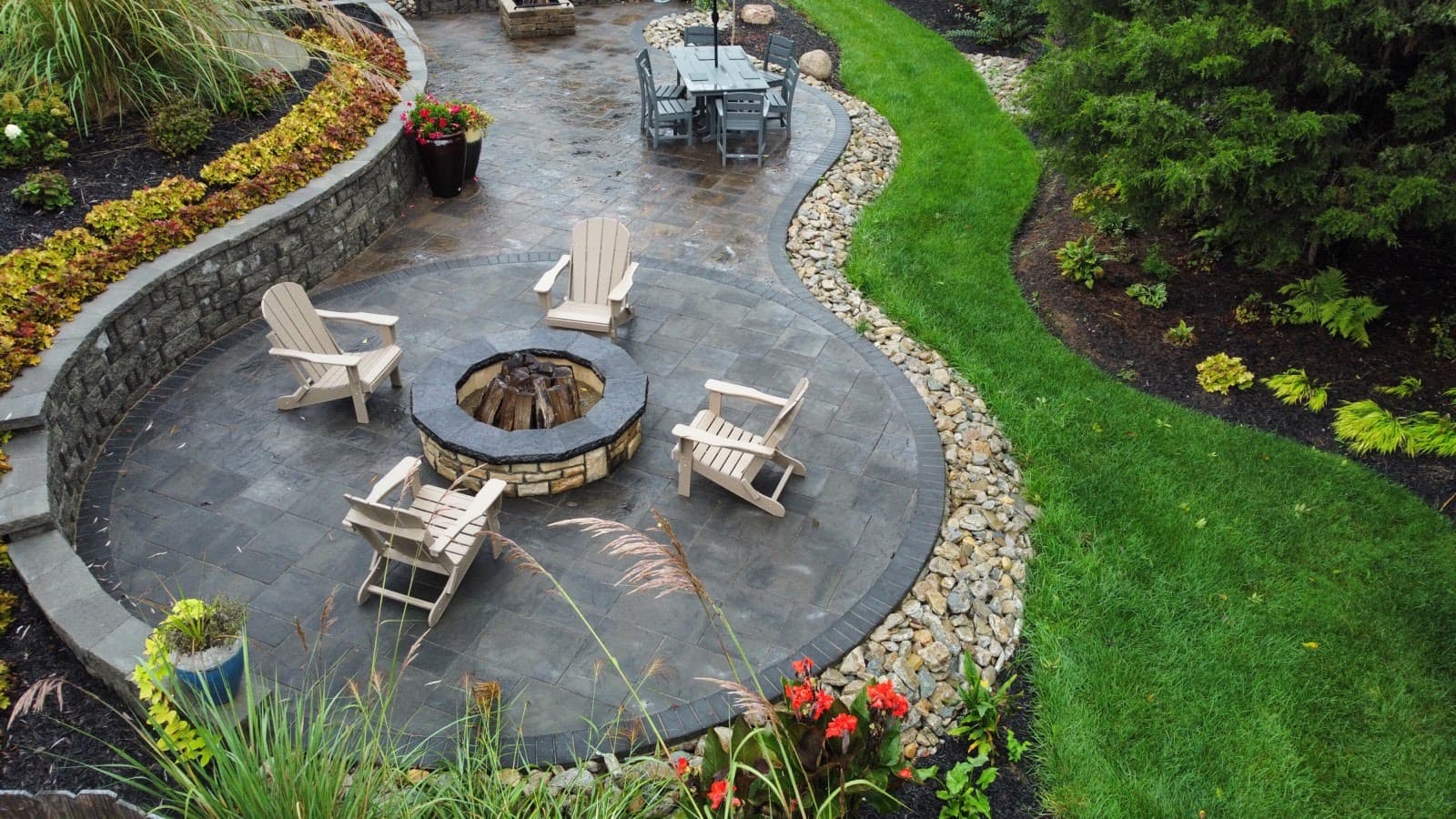 Beautiful stamped concrete patio with fire pit and outdoor living area